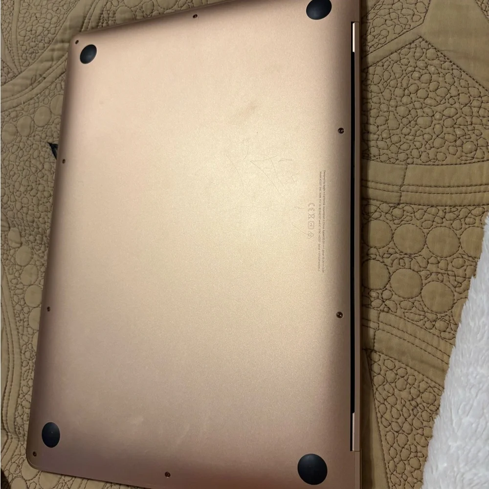 Apple MacBook in Gold with Unique Stickers